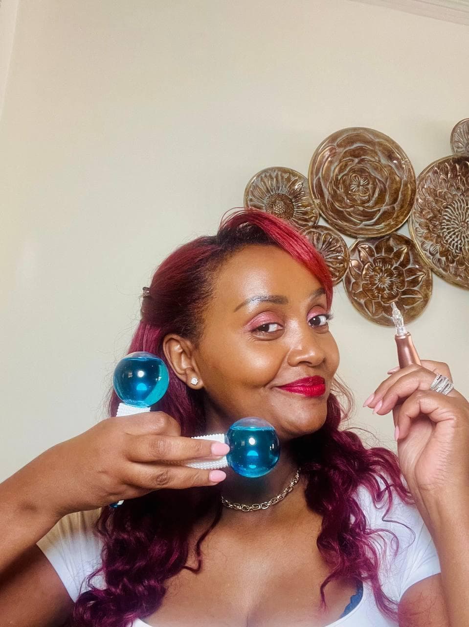 Esthetician at Rama Beauty holding cooling facial globes
